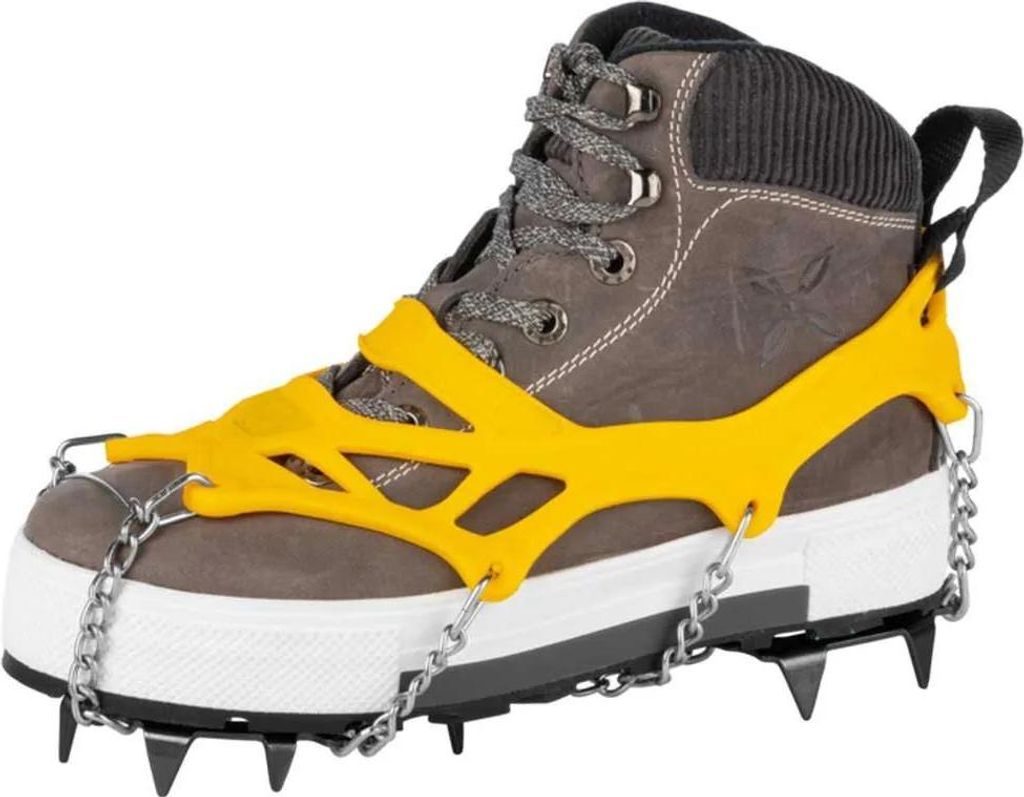 A single boot with yellow ice cleats attached, shown against a white background.