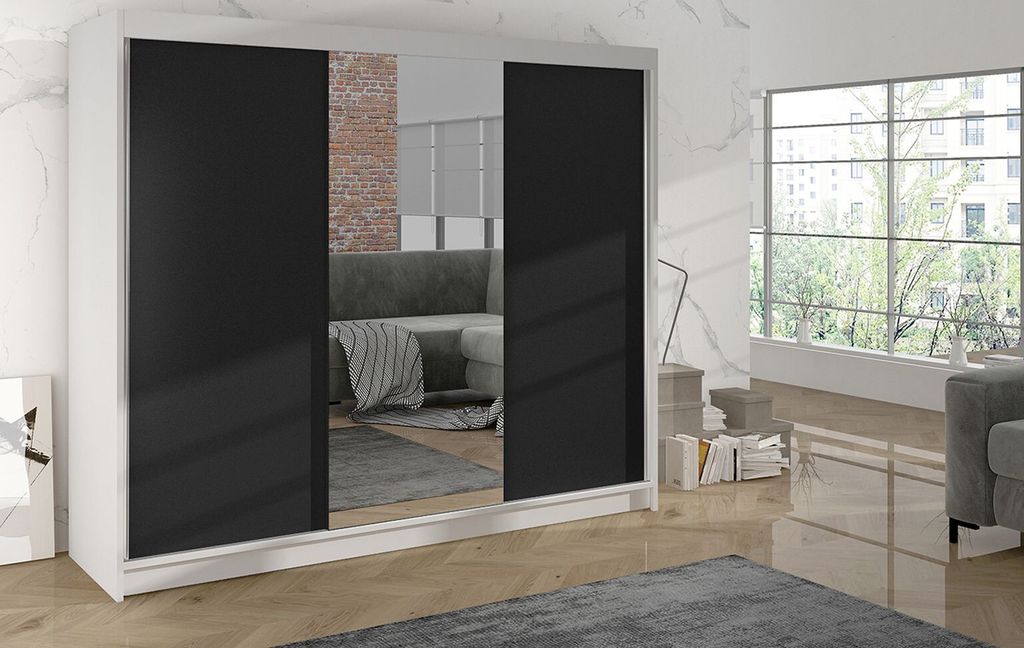 A modern bedroom with a large wardrobe and a window view.