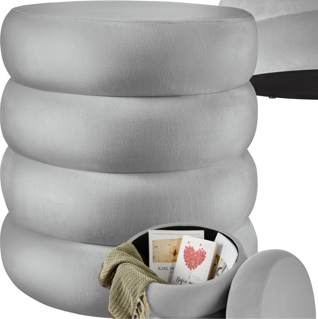A stack of round, gray ottomans, with the bottom one open to reveal storage.