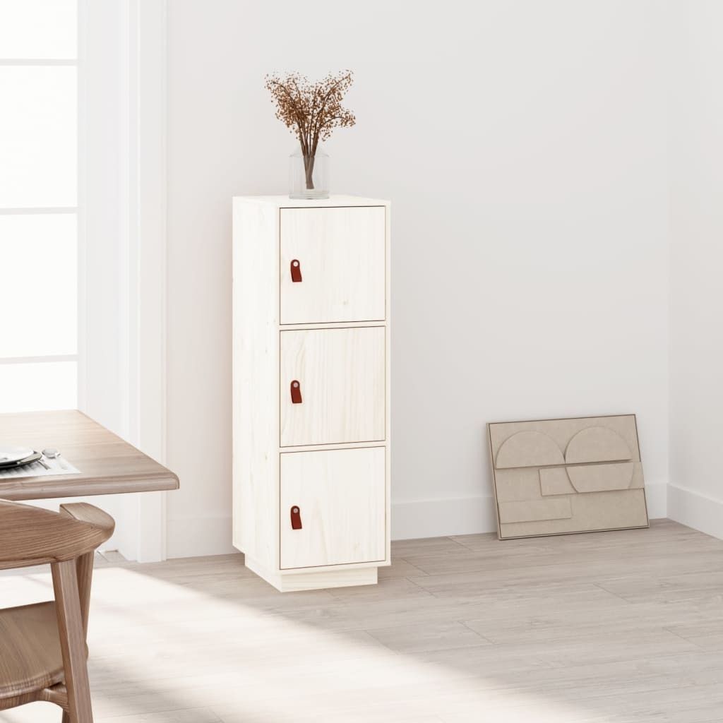 A tall, narrow wooden cabinet with three doors stands against a white wall, next to a wooden dining table and chair.