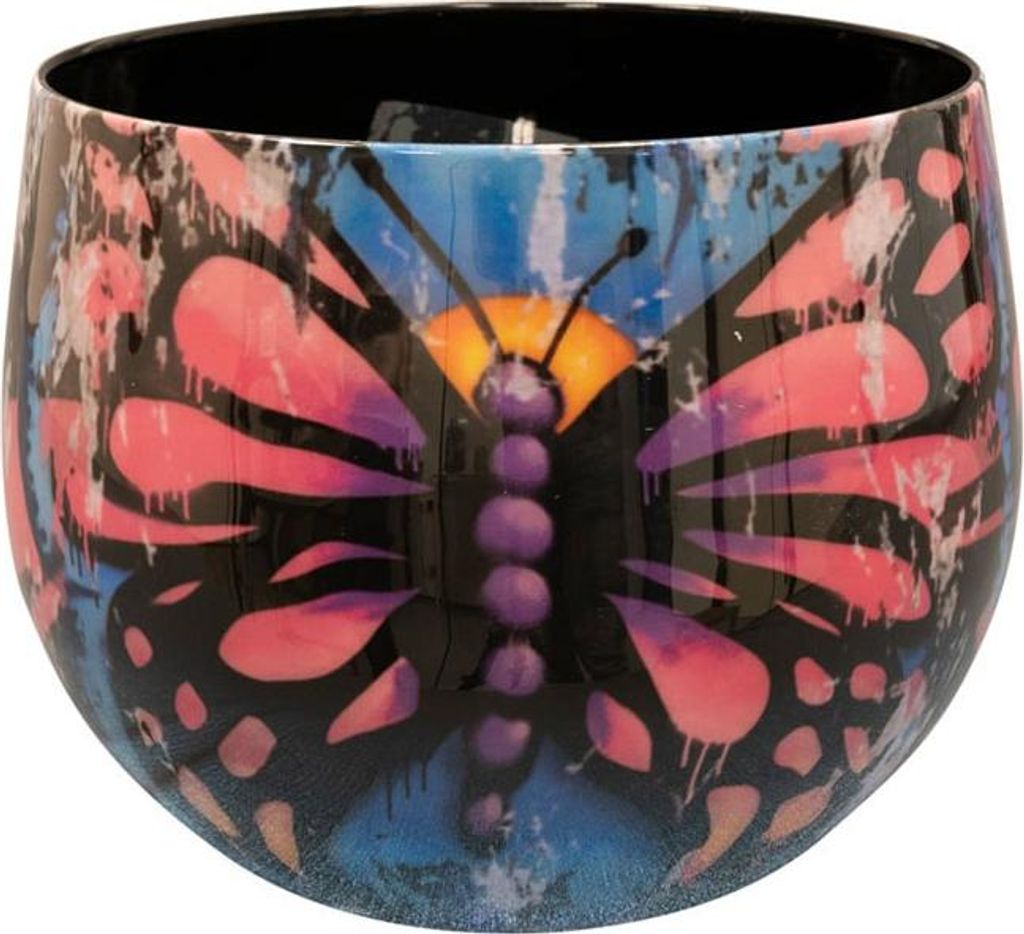 A close-up studio shot of a decorative pot with a butterfly design.