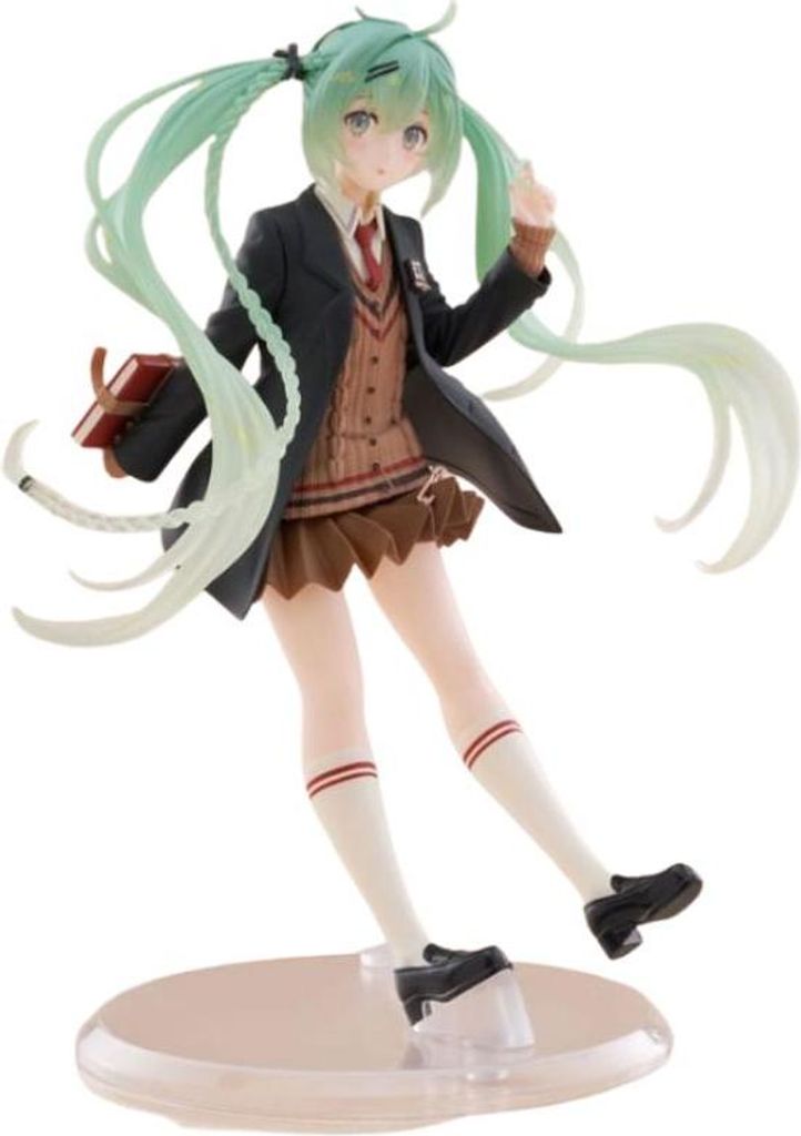 A figurine of Hatsune Miku in a school uniform, holding a book.