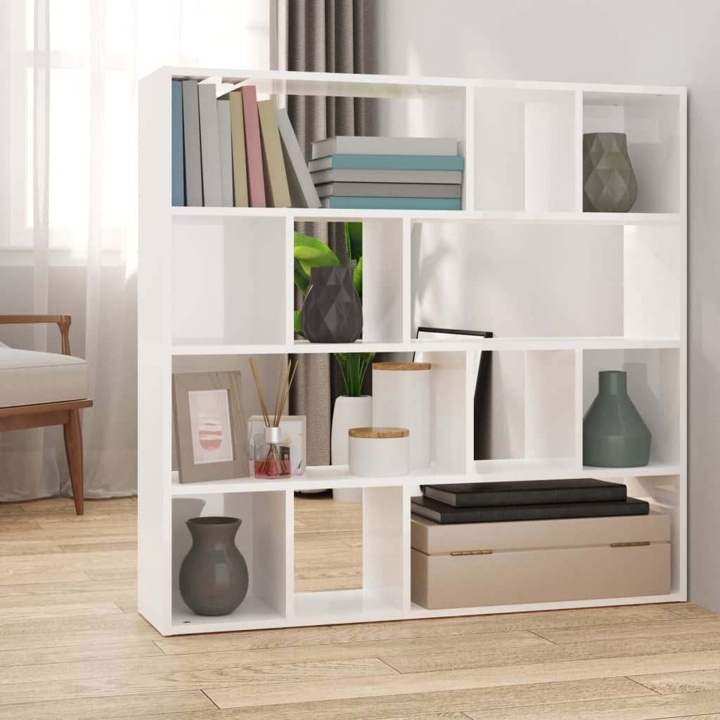 A white bookshelf filled with decorative items and books, placed in a room with natural light.