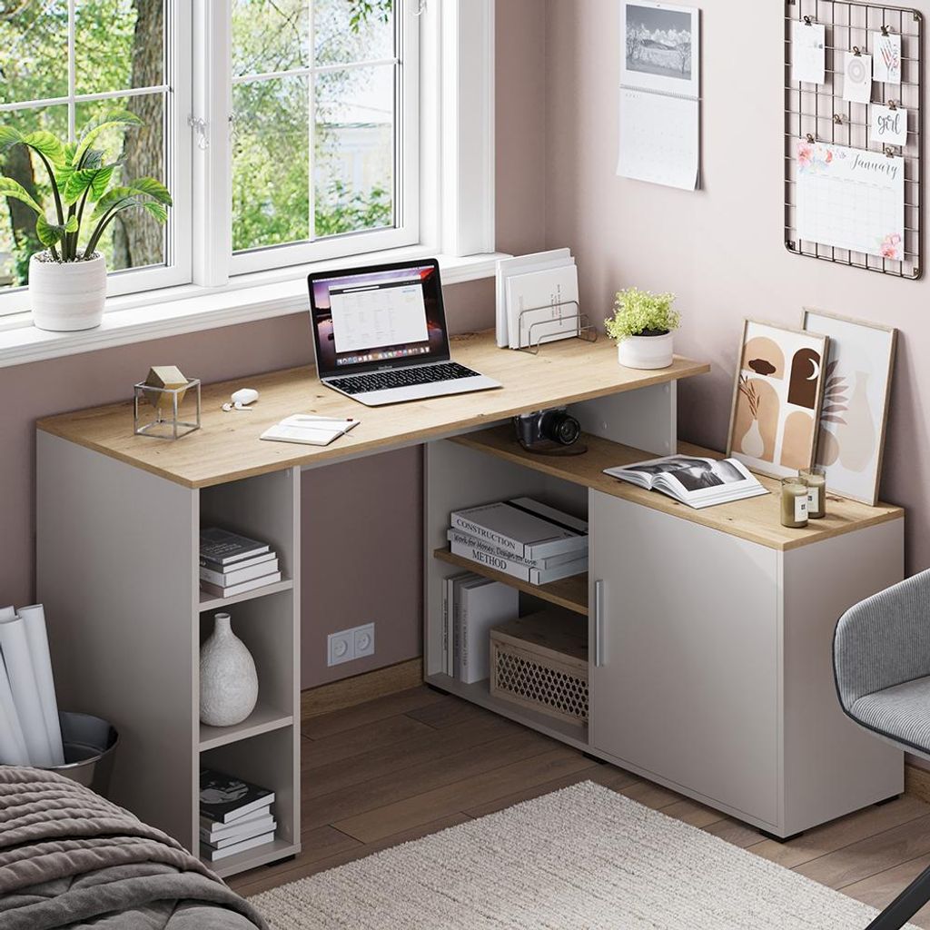 A home office corner with a desk, laptop, and decorative items.