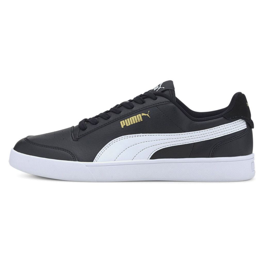 A side view of a black Puma sneaker with a white stripe and gold Puma logo.