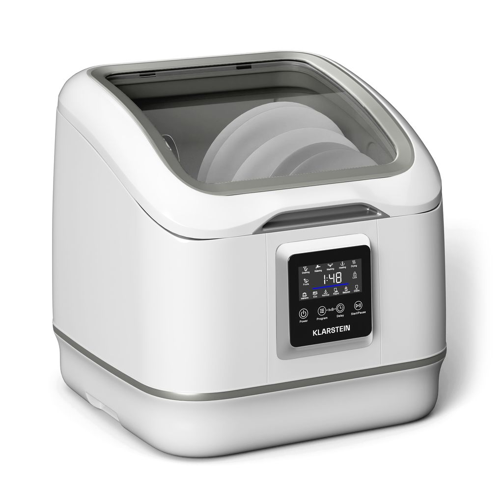 A white Klarstein SilentScrub countertop dishwasher is shown against a white background. The dishwasher has a transparent lid, revealing stacked plates inside. A digital touchscreen display is visible on the front.