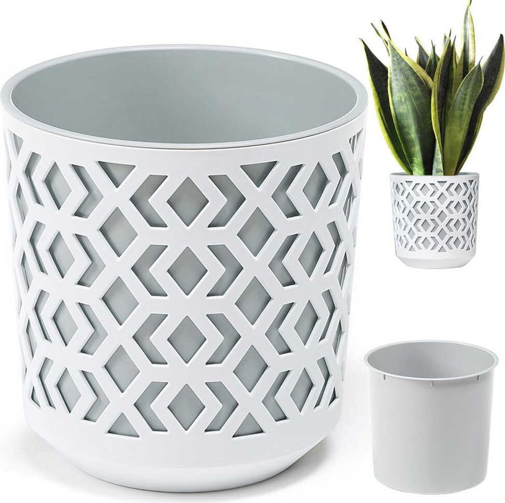 A white planter with a geometric cut-out pattern and a grey inner pot, shown with a smaller planter containing a snake plant and a separate inner pot.