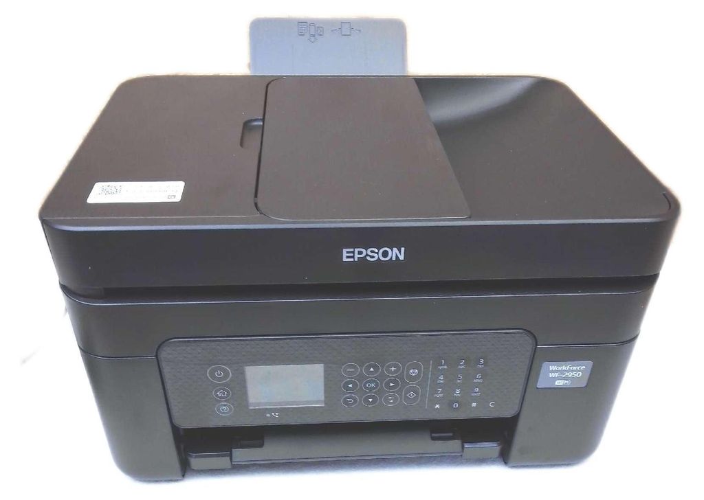 A black Epson WorkForce WF-2950DWF wireless multifunction printer is shown from a front-facing diagonal angle.