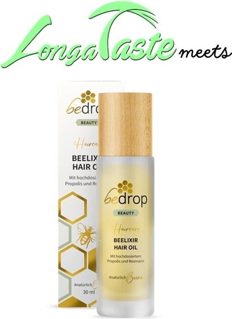 A bottle of hair oil and its packaging.