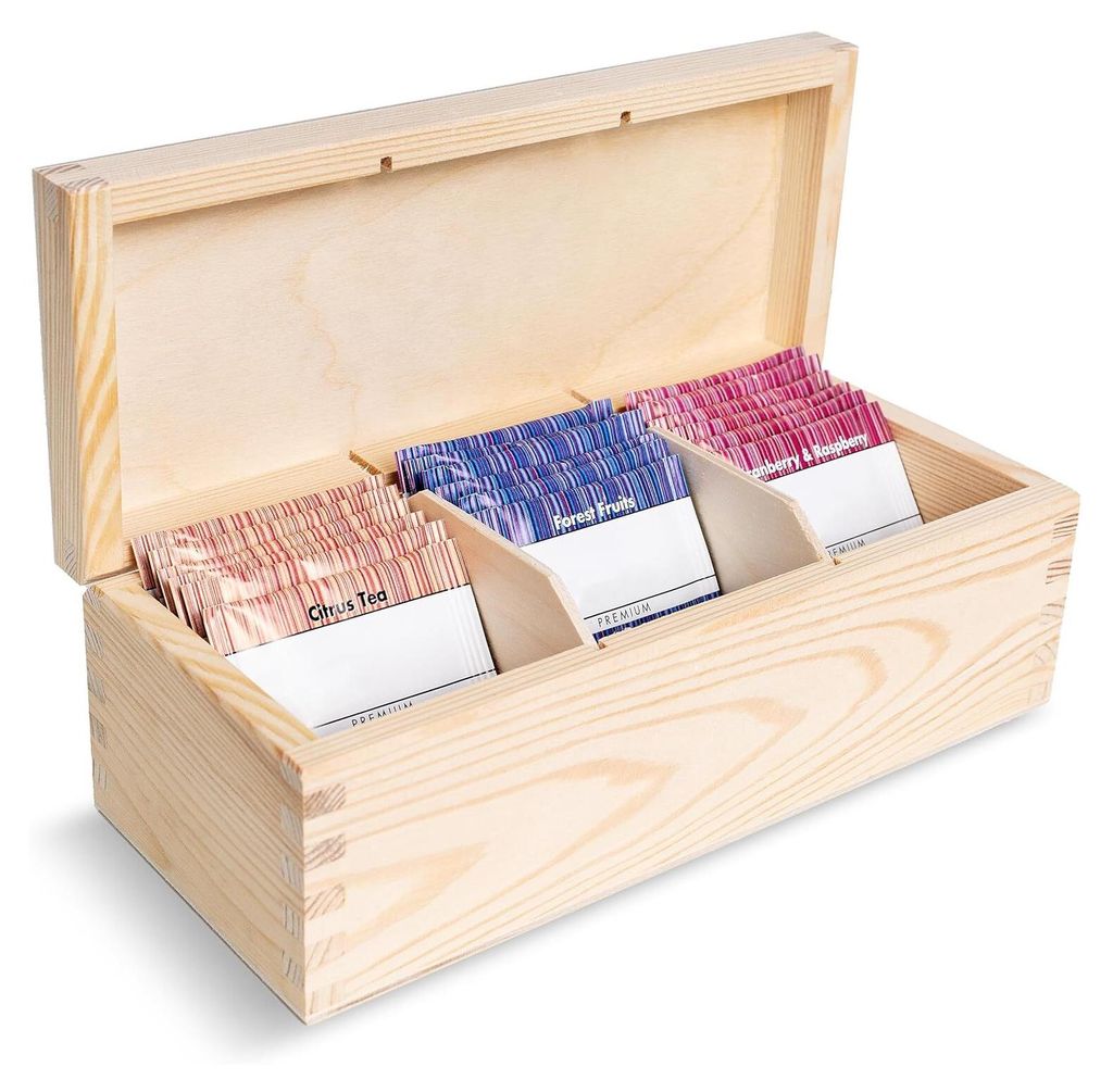 A wooden box with three compartments filled with tea bags.