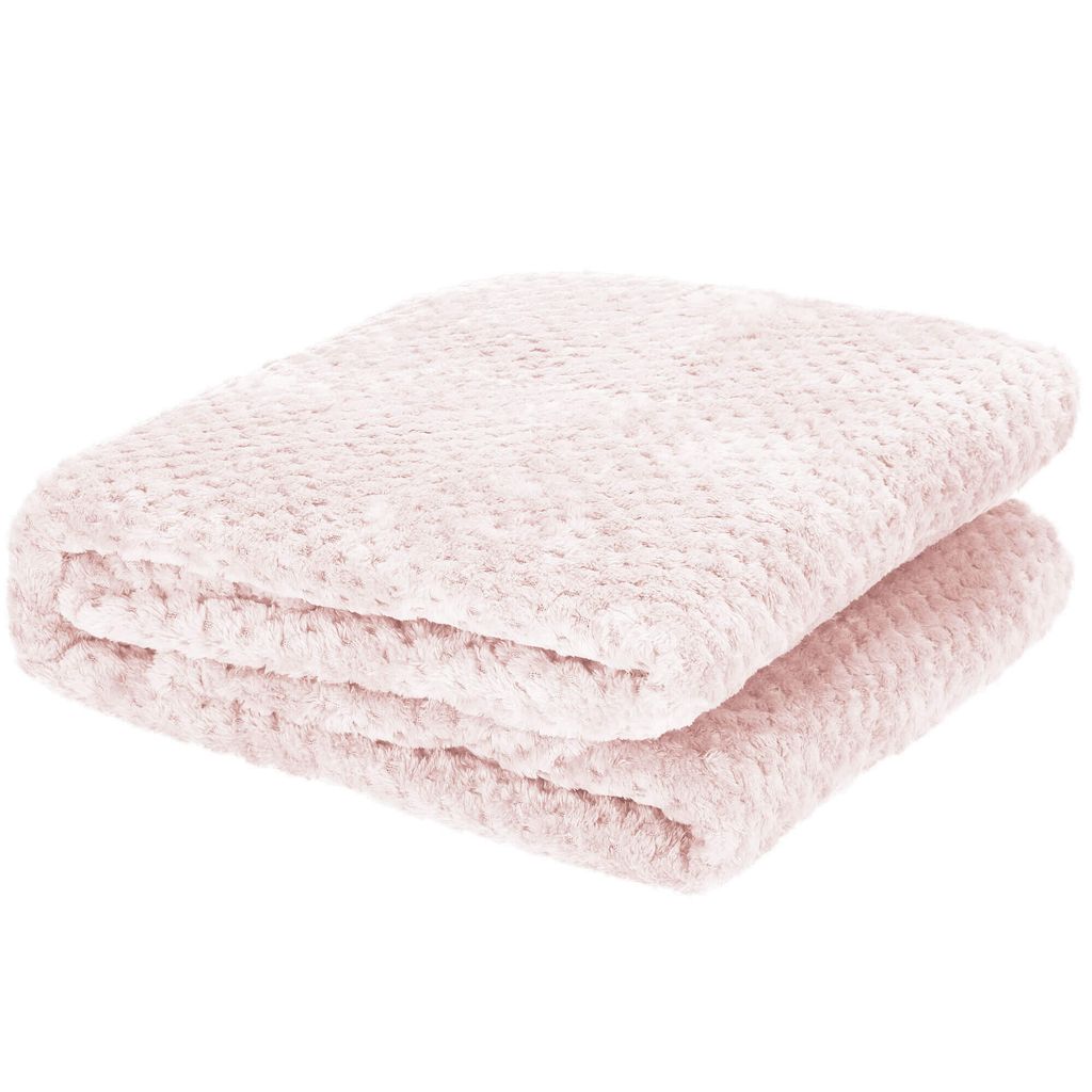 A folded pink blanket with a textured pattern.