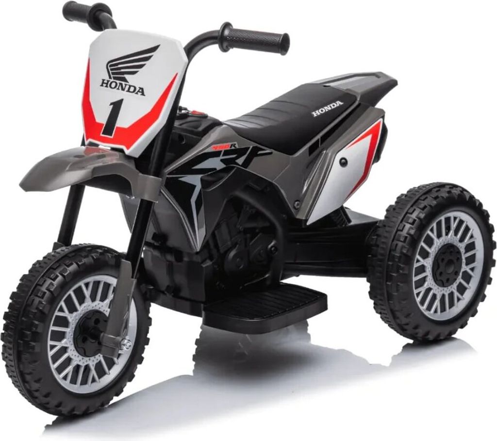 A three-wheeled electric toy motorcycle with Honda branding.