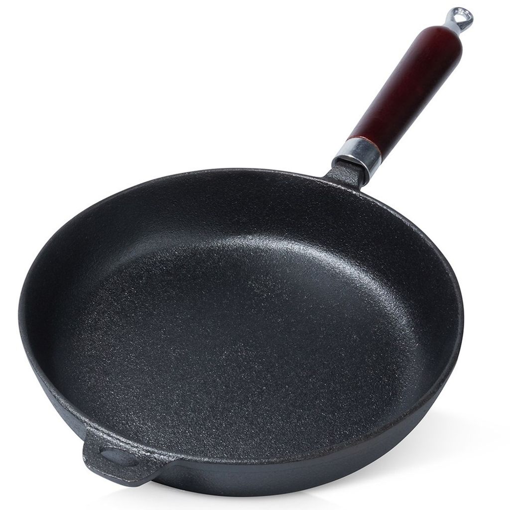 A cast iron frying pan with a wooden handle, shown from a slightly elevated angle against a white background.