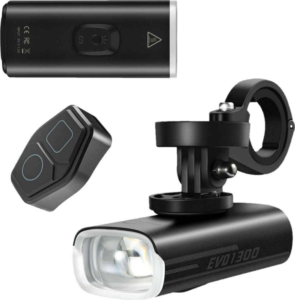 A product shot of a bicycle front light, its remote control, and a Garmin mount, all presented on a white background.