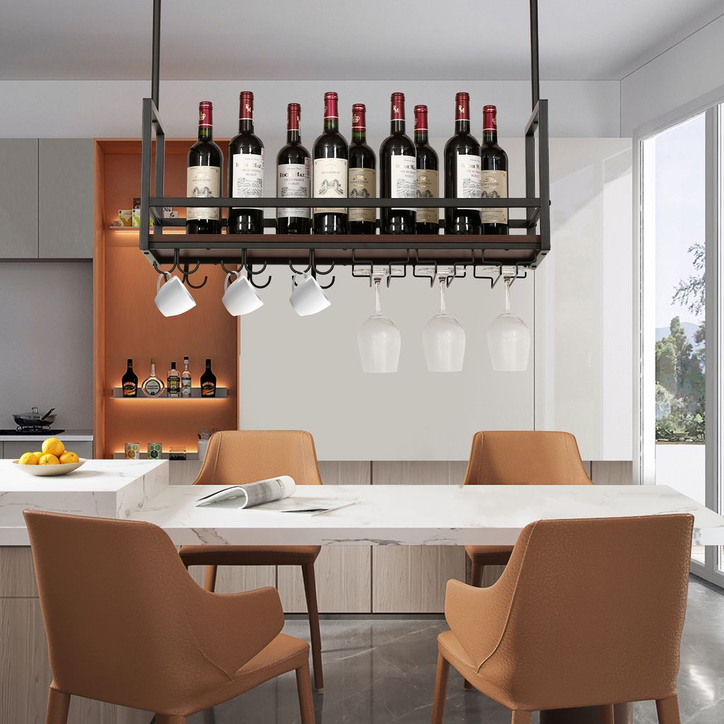 A modern dining room with a wine rack hanging above a table.