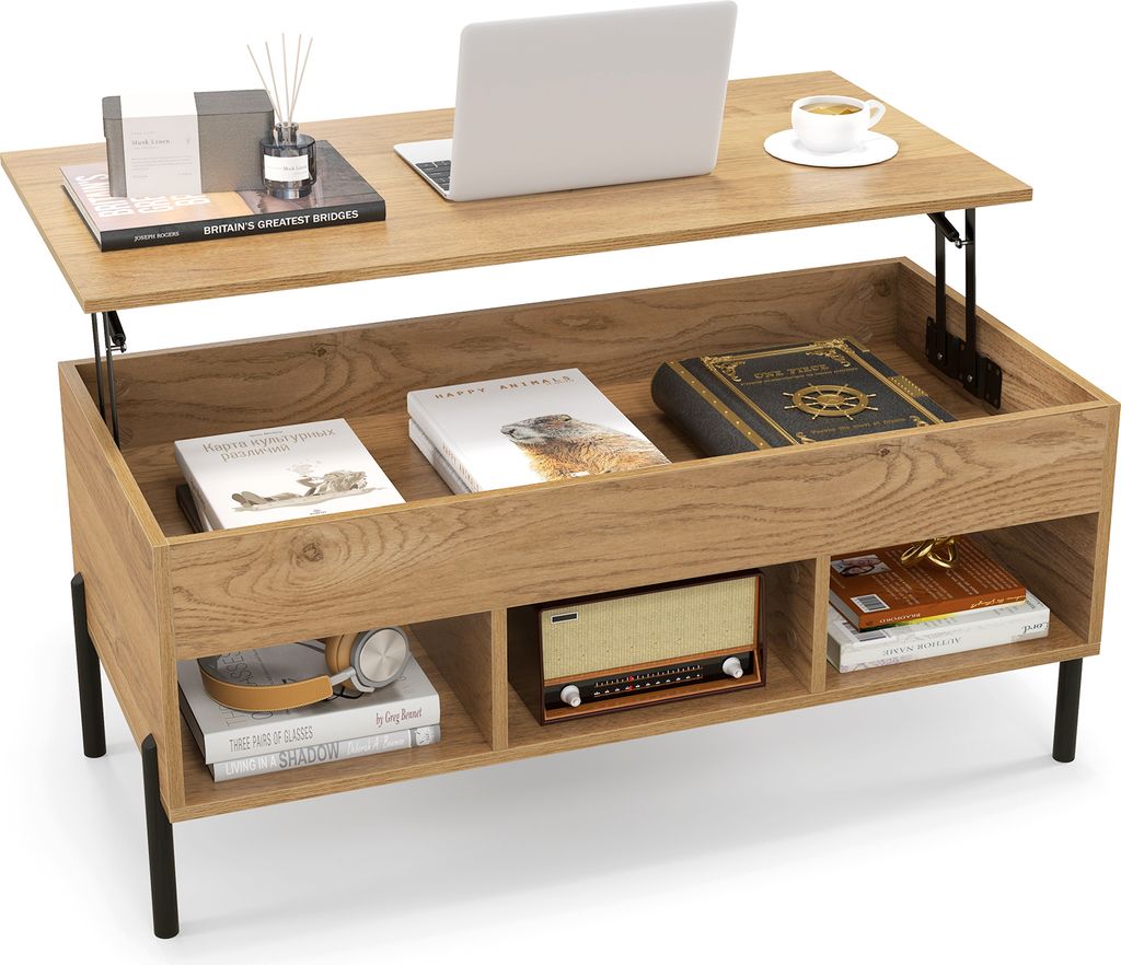 A wooden coffee table with a lift-top mechanism and storage compartments, displaying various items like books, a laptop, and a vintage radio.