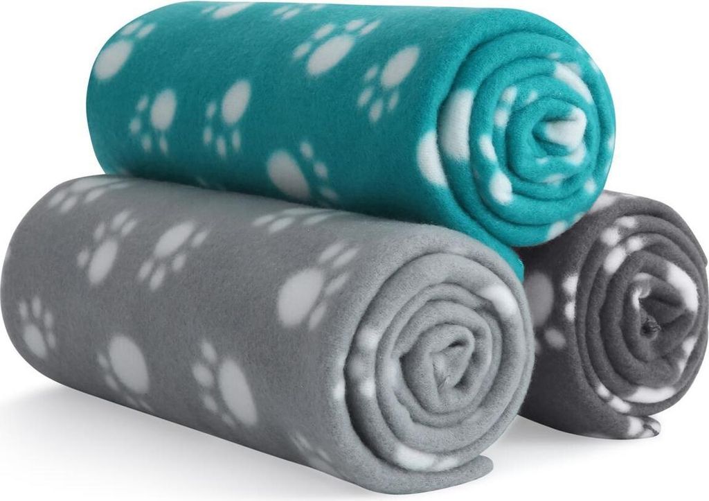 Three rolled-up fleece blankets with paw print patterns are stacked on a white background.