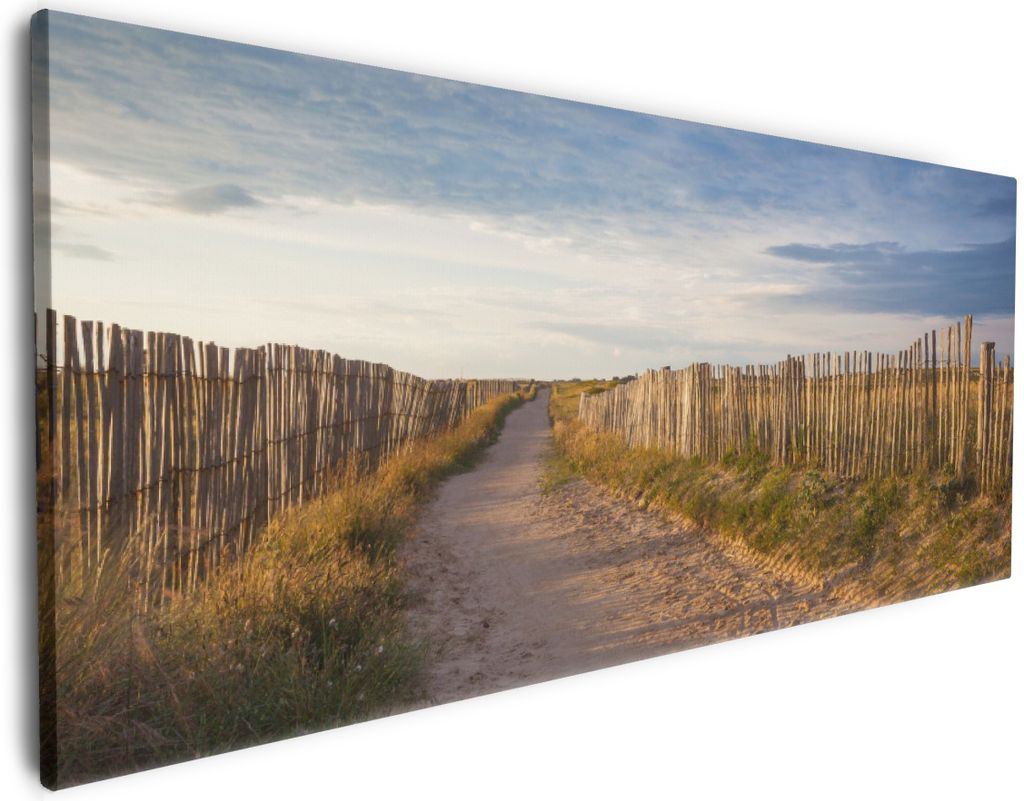 Wallario Premium Leinwandbild Sandweg an einem Strand in Frankreich, Bretagne in Größe 50 x 125 cm