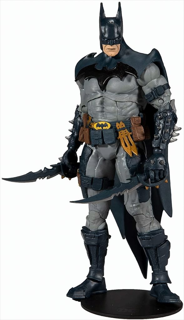 A full-body shot of a Batman action figure standing on a black display base against a white background.