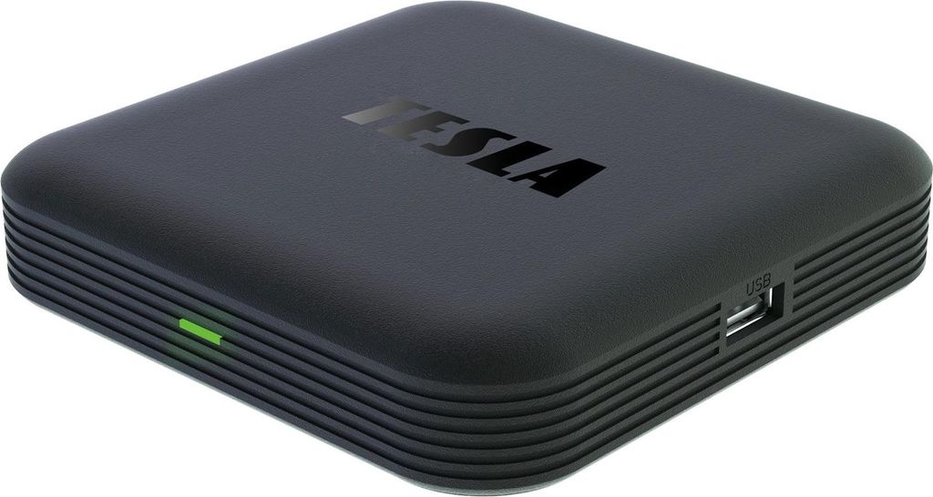 A black media box with the TESLA logo on top.