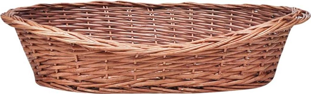 A close-up, front-facing view of an empty, oval-shaped wicker basket.