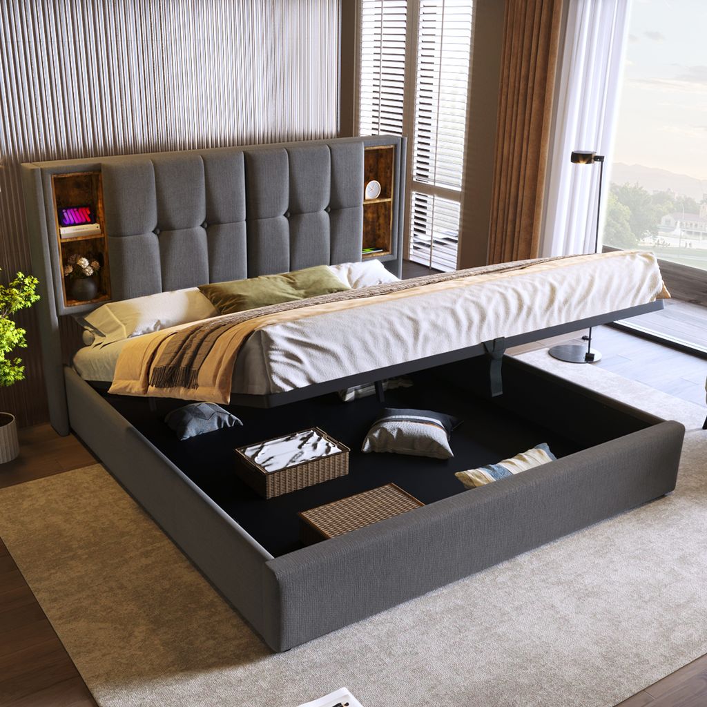 A modern bedroom with a large upholstered bed with storage, showing the lift-up mattress revealing the storage space underneath.
