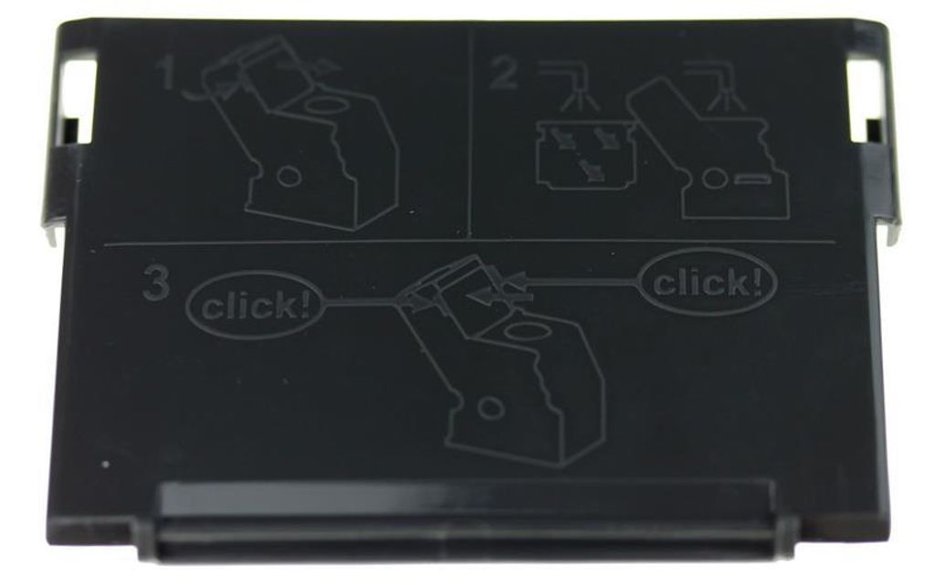 Instructional diagram on a black plastic part.