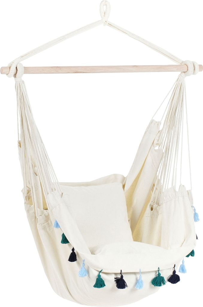A hanging chair with tassels.