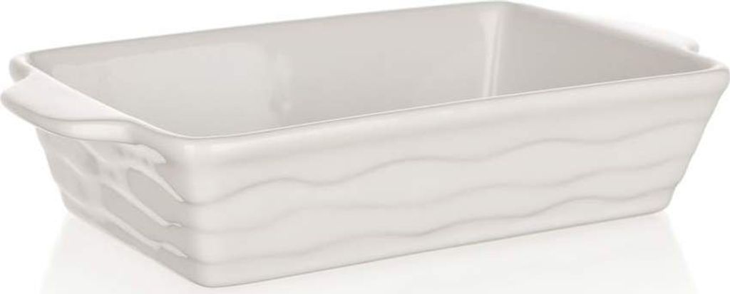 A white ceramic baking dish with a wavy texture on the sides.