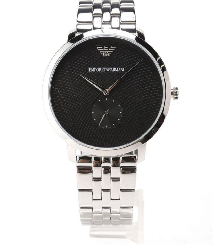 A close-up studio shot of an Emporio Armani watch against a white background.
