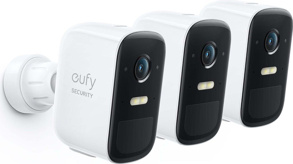 Three white security cameras with black accents are arranged diagonally on a white background.