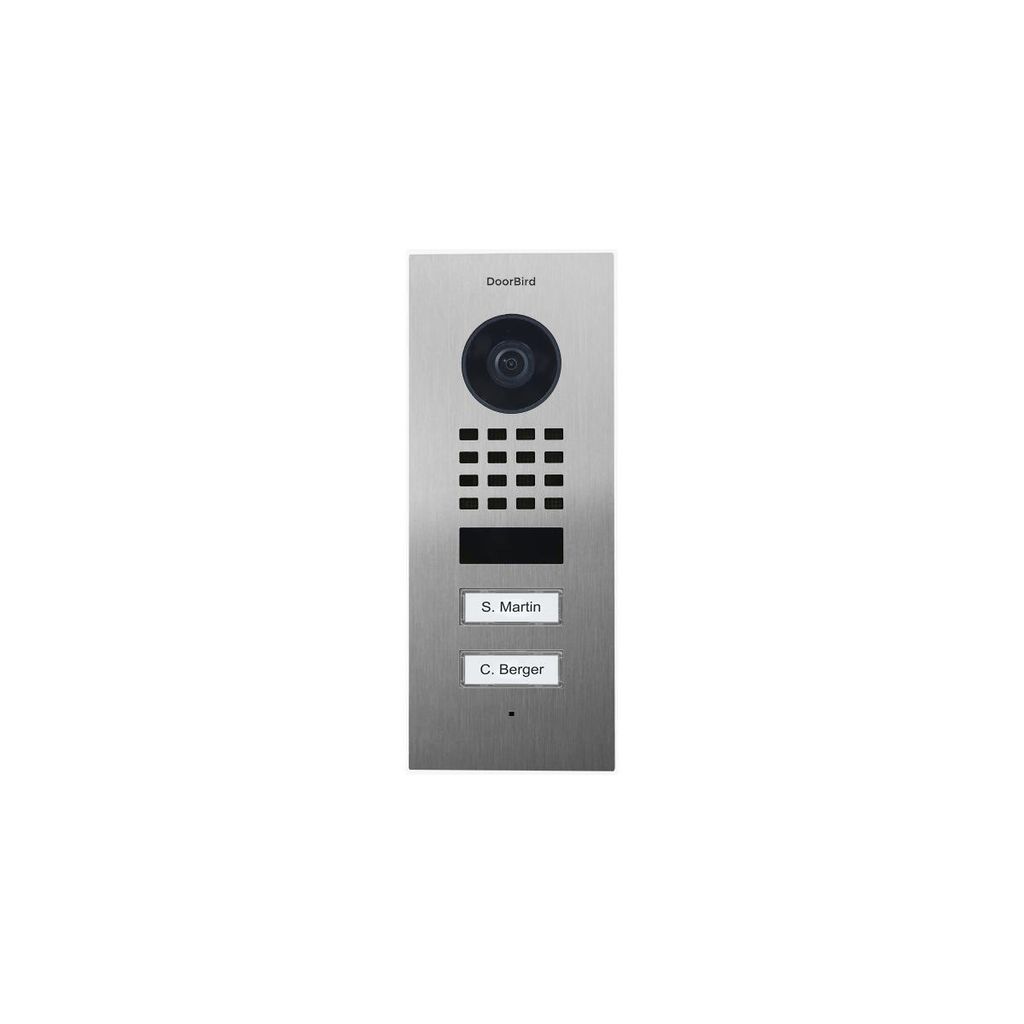 A DoorBird IP video door station with a camera, keypad, and nameplates, presented on a white background.