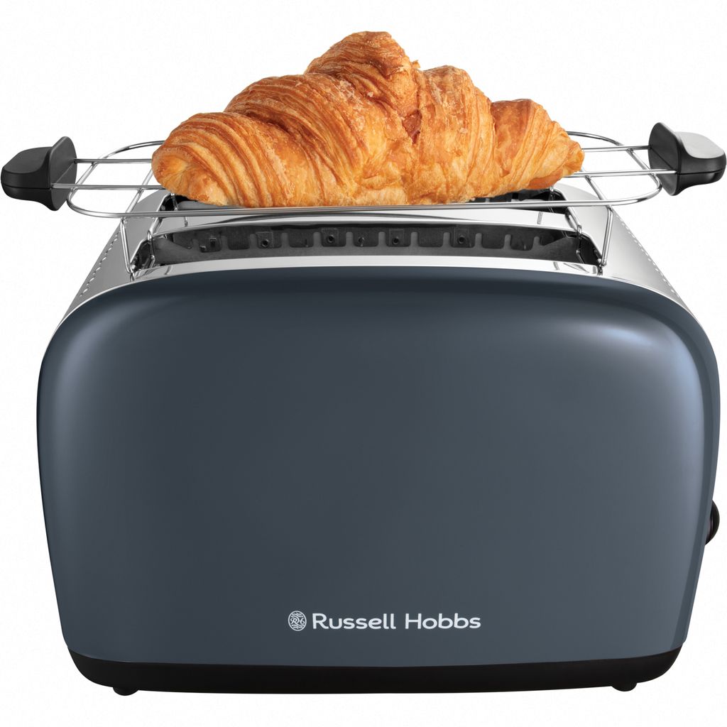 A gray Russell Hobbs toaster with a croissant on a warming rack.