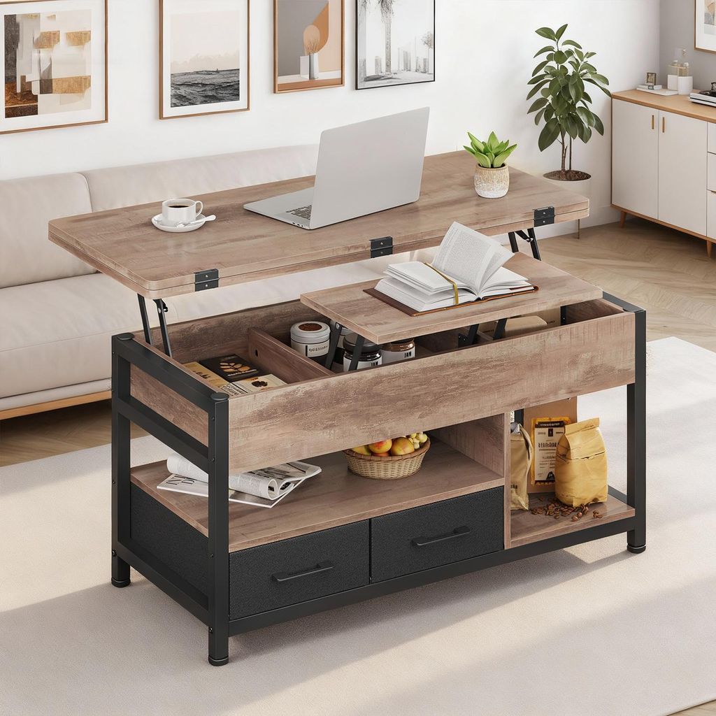 A lift-top coffee table in a living room setting, with a laptop and coffee cup on top.