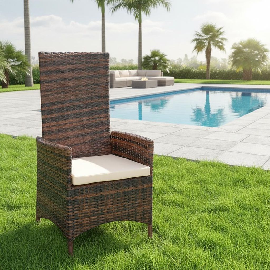 A brown rattan chair with a beige cushion is placed on a green lawn next to a swimming pool.
