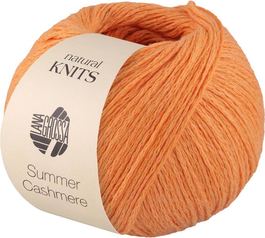 A ball of orange yarn with a label.