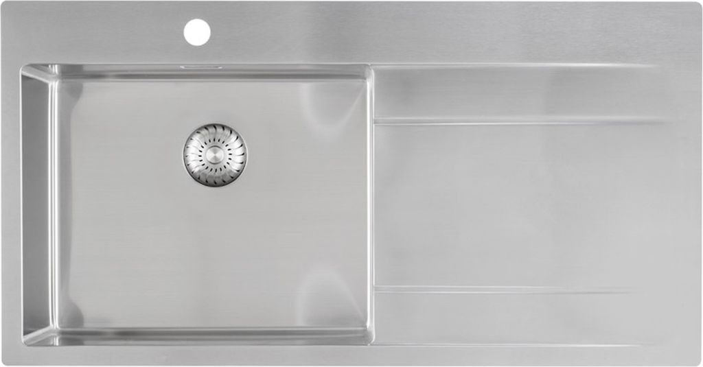 A top-down view of a stainless steel kitchen sink with a drainer.