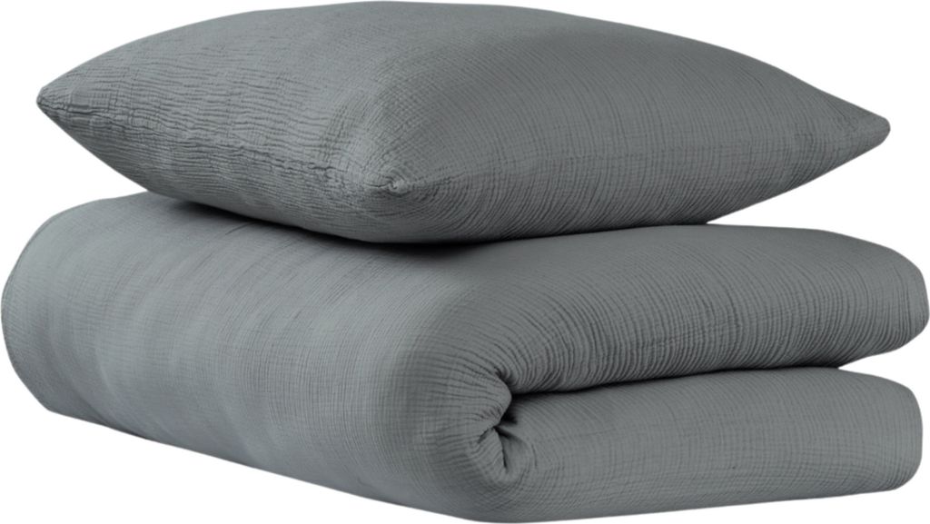 A folded duvet and pillow in dark gray.