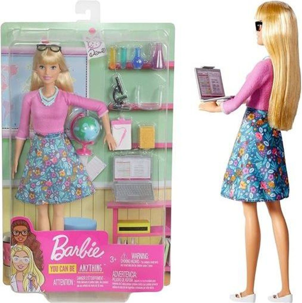 A Barbie doll in its original packaging, presented as a teacher with accessories.