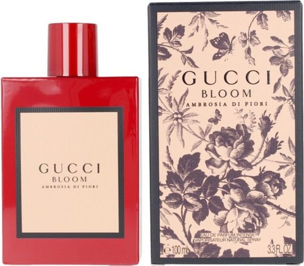 A red bottle of Gucci Bloom Ambrosia di Fiori perfume is shown next to its packaging.