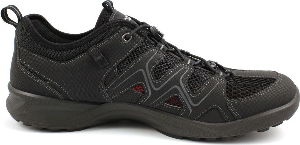 A side view of a black athletic shoe.