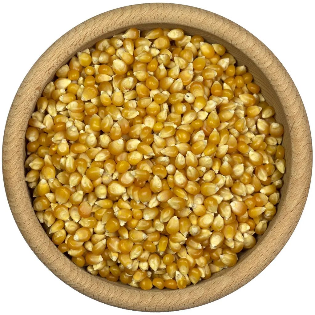 A close-up, top-down view of popcorn kernels in a wooden bowl.