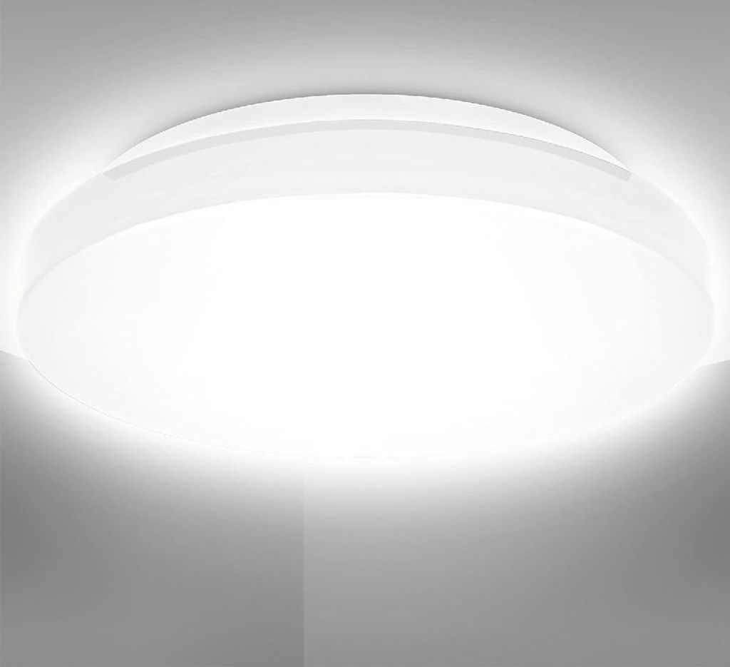 A close-up view of a white, circular ceiling light fixture mounted on a white ceiling.