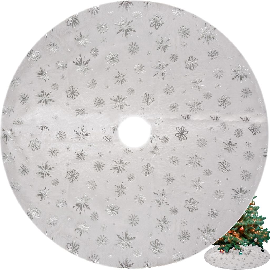 A white Christmas tree skirt with silver snowflake patterns is shown flat on a white background. A small inset image shows the skirt around the base of a decorated Christmas tree.