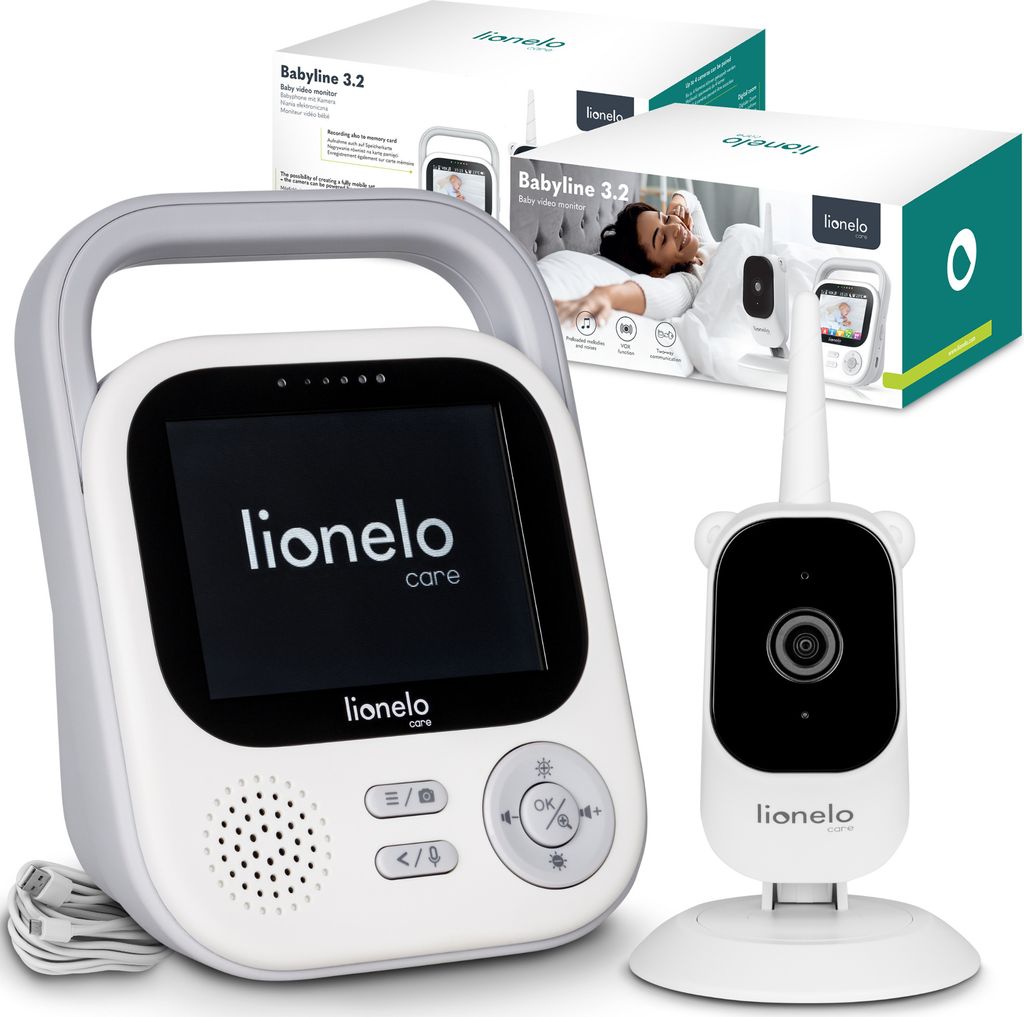 A baby monitor set including a parent unit and a camera unit, with packaging in the background.