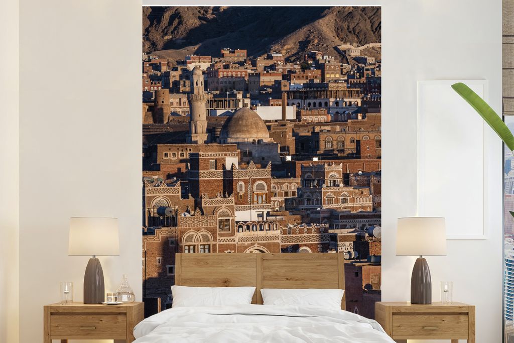 MuchoWow Fototapete für Wohnzimmer oder Schlafzimmer Wandtapete Vinyl Motivtapete Stadtbild der Altstadt von Sanaa mit der Sonne des Jemen - 200...