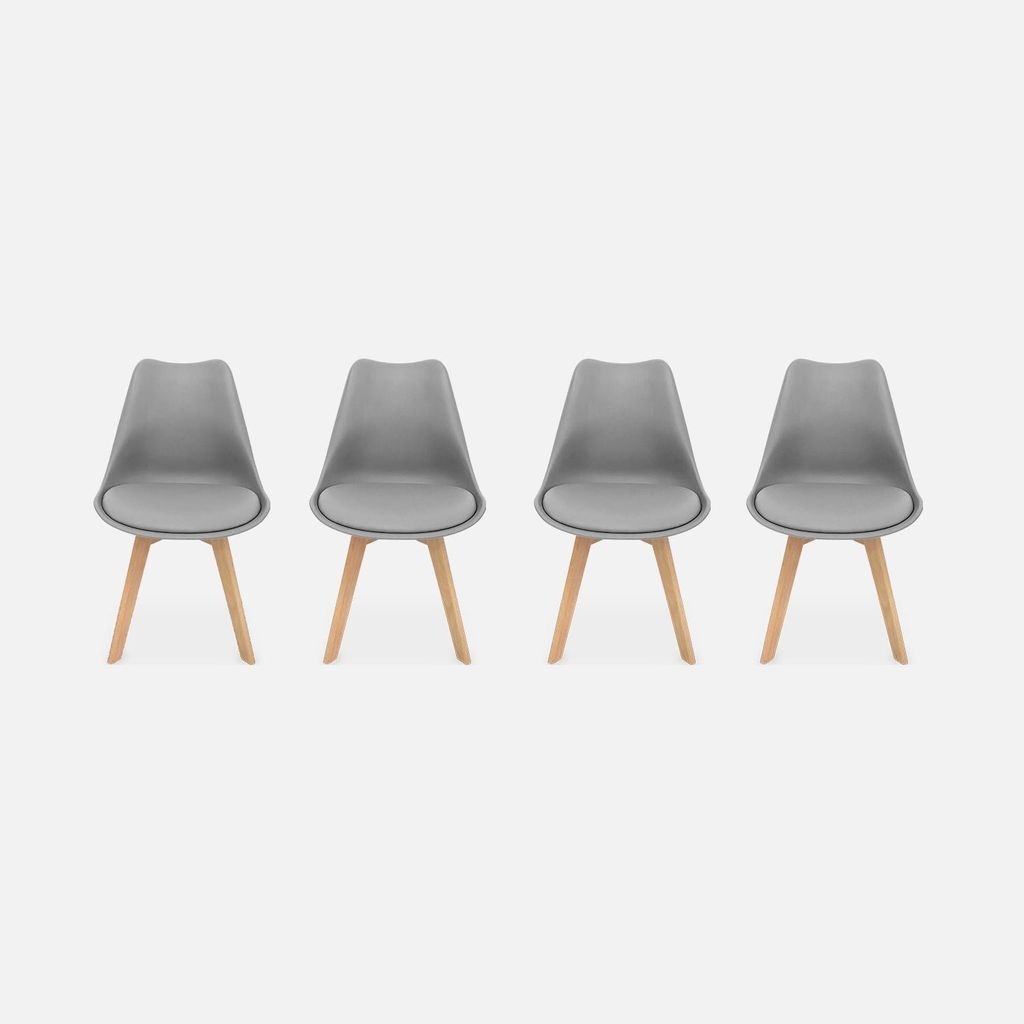 Four gray chairs with wooden legs are arranged in a row against a white background.