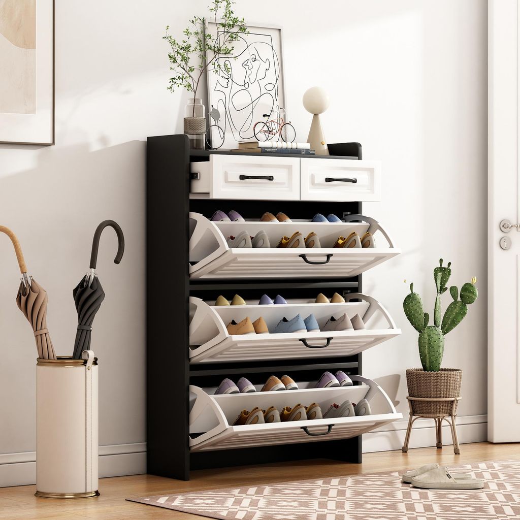 A shoe cabinet with drawers and flip-out shelves is shown in a room setting, next to an umbrella stand and a potted plant.