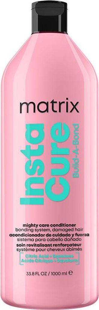 A pink bottle of Matrix Total Results Insta Cure Build-A-Bond Conditioner.