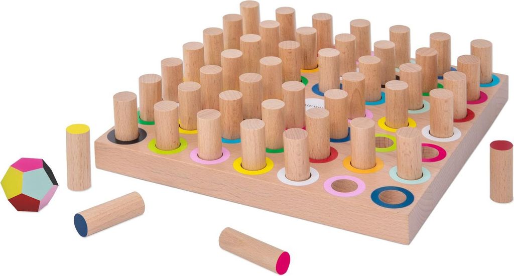 A wooden educational toy with pegs and colored rings, along with some loose pegs and a geometric shape.